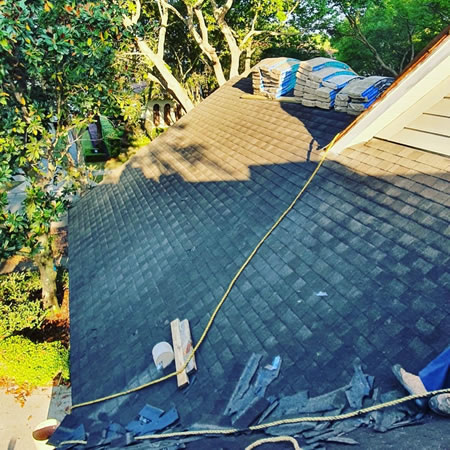 Late-summer roof inspection of asphalt shingles and flashing on a DeLand, Florida home